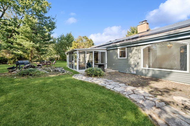 view of yard with a sunroom