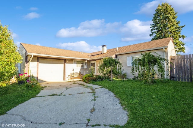 ranch-style house featuring a garage and a front yard