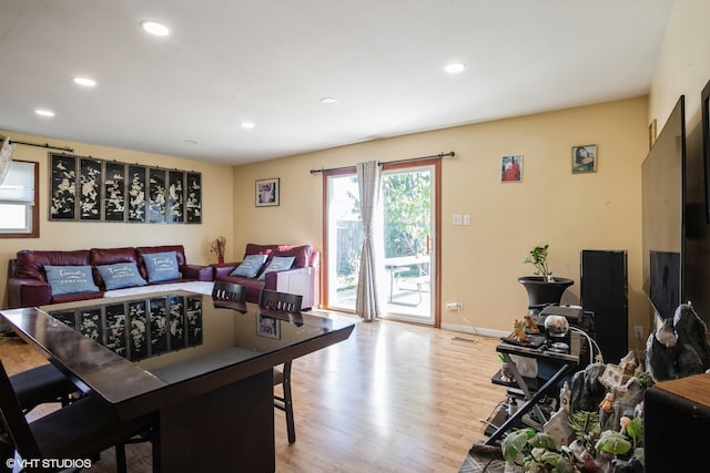 dining space with hardwood / wood-style floors