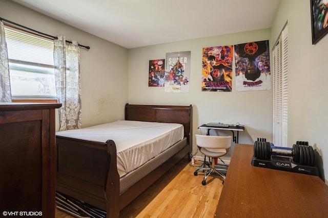 bedroom featuring a closet and hardwood / wood-style floors