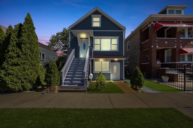 view of front of home featuring a lawn