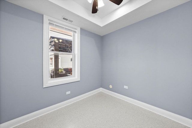 empty room with carpet flooring and ceiling fan