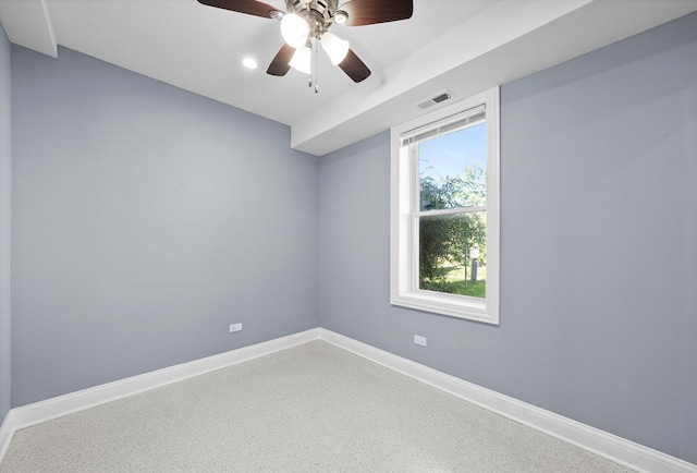 empty room with carpet flooring and ceiling fan