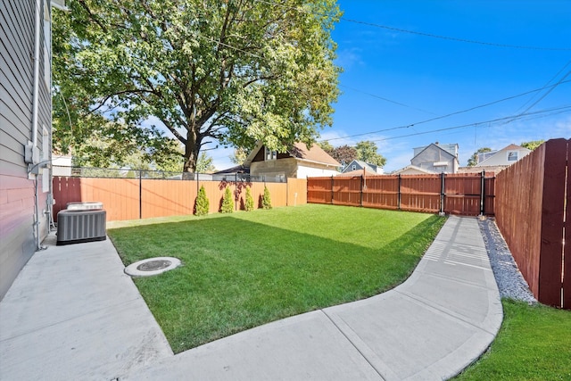 view of yard featuring central AC