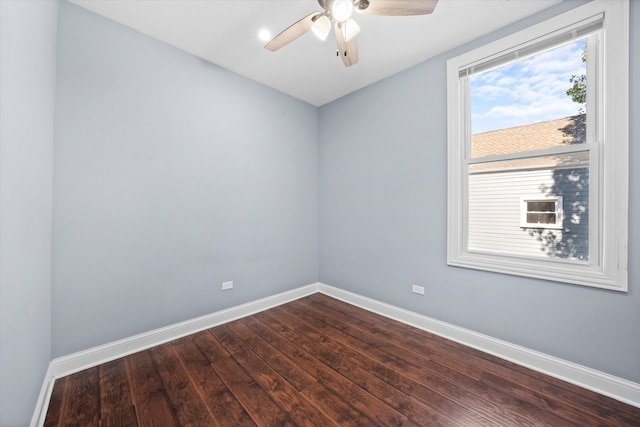 empty room featuring hardwood / wood-style floors and ceiling fan