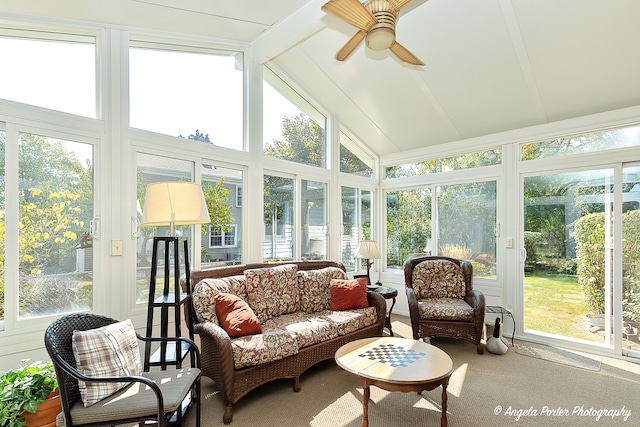 sunroom / solarium with lofted ceiling with beams and ceiling fan