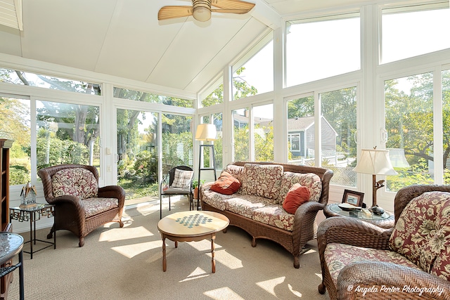 sunroom / solarium with lofted ceiling and ceiling fan