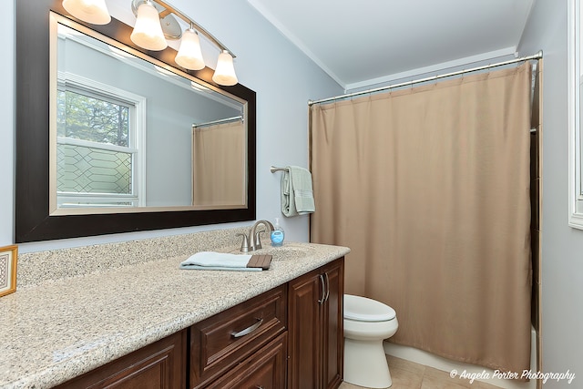 bathroom featuring tile patterned flooring, a shower with curtain, vanity, and toilet