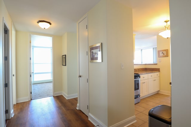 corridor featuring light hardwood / wood-style floors