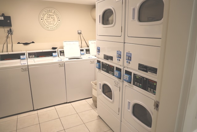 washroom featuring stacked washer and dryer, separate washer and dryer, and light tile patterned floors