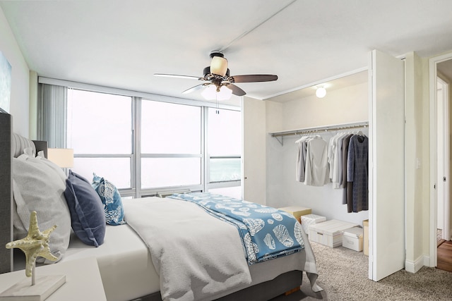 bedroom featuring a closet, ceiling fan, and carpet floors