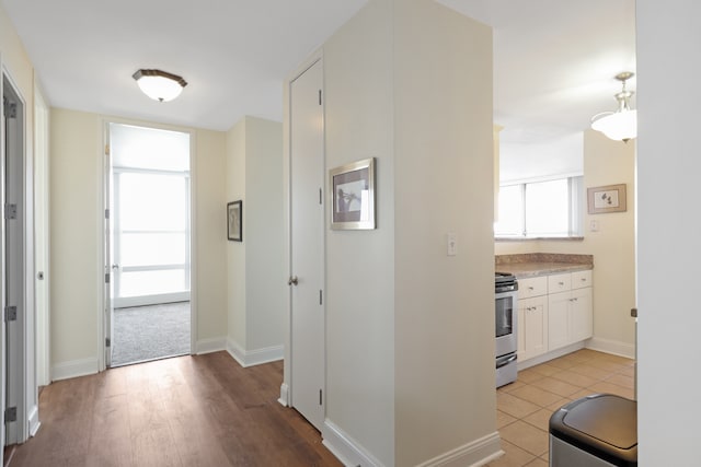 hall with light hardwood / wood-style flooring