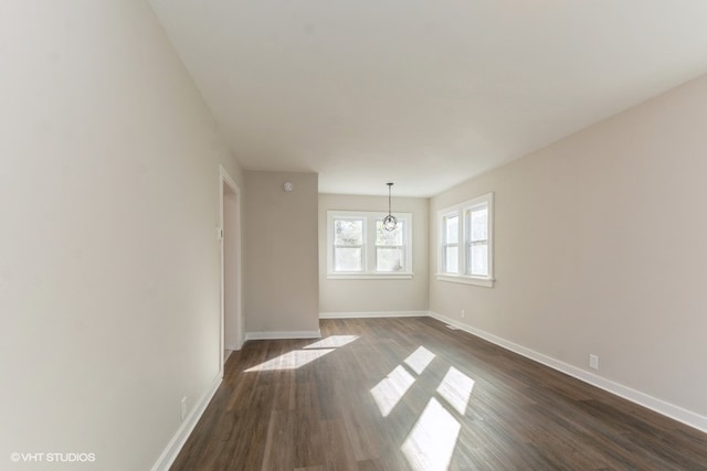 empty room featuring dark hardwood / wood-style flooring