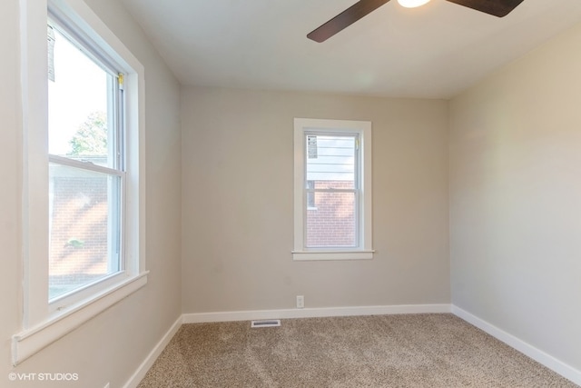 carpeted empty room with ceiling fan