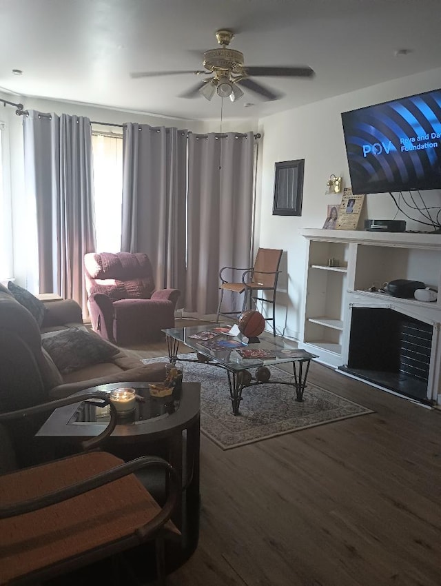 living room with ceiling fan and hardwood / wood-style flooring