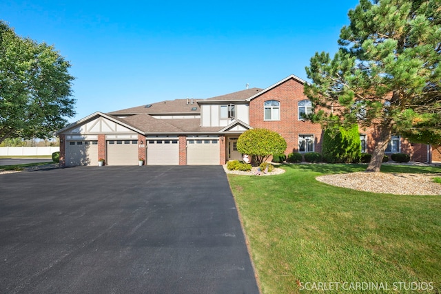 view of front of home featuring a front yard and a garage