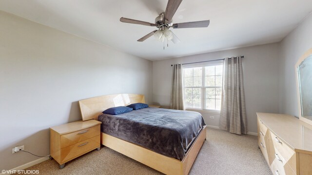 carpeted bedroom featuring ceiling fan