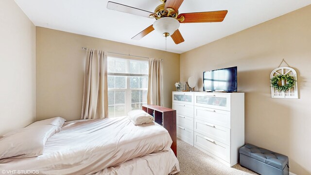 carpeted bedroom with ceiling fan