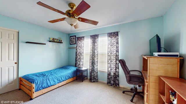 carpeted bedroom featuring ceiling fan