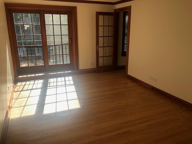 512 W Barry Ave Unit 201, Chicago, IL 60657 - empty room with baseboards and wood finished floors