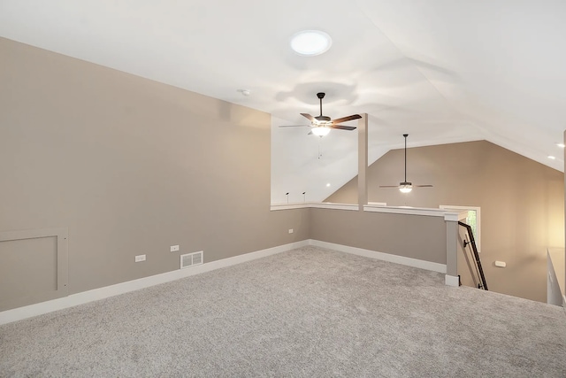 interior space featuring lofted ceiling, carpet floors, and ceiling fan