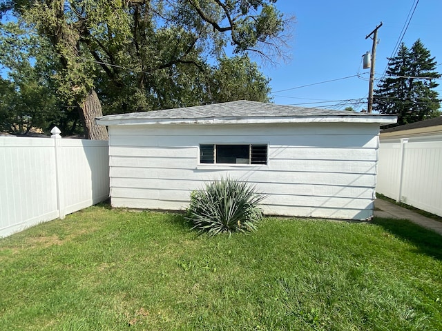 view of outbuilding featuring a lawn