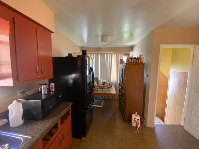 kitchen with black appliances and sink