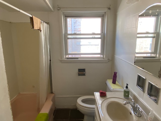 full bathroom with tile patterned flooring, shower / bath combo, vanity, and toilet