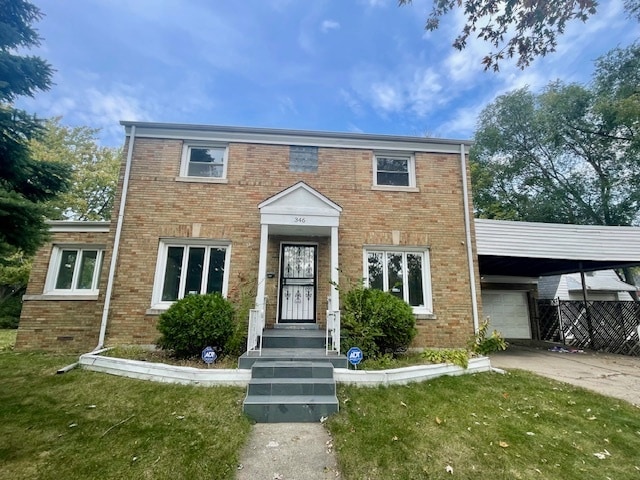 view of front of property with a front lawn and a carport