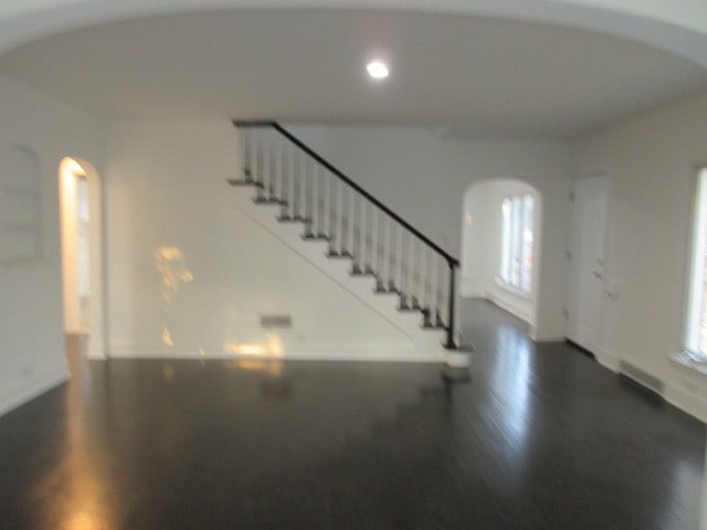 entrance foyer with dark hardwood / wood-style flooring