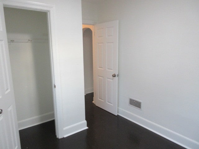 unfurnished bedroom with a closet