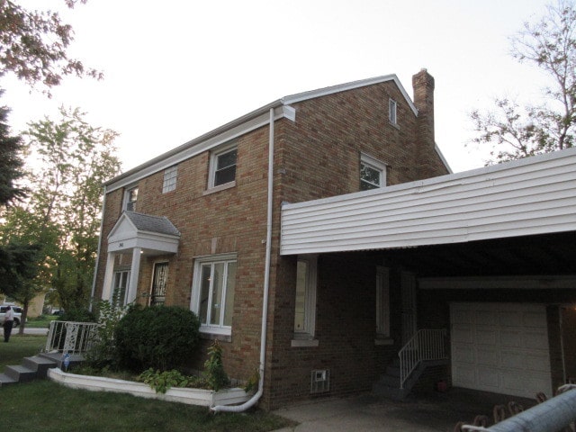 view of side of home featuring a garage