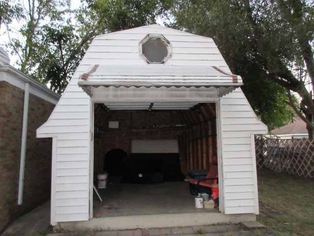 view of vehicle parking featuring a garage