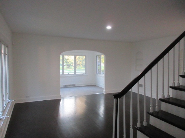 stairs with hardwood / wood-style floors