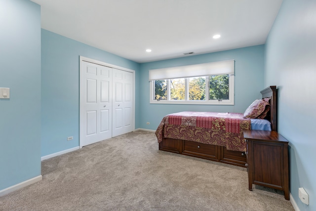 carpeted bedroom featuring a closet