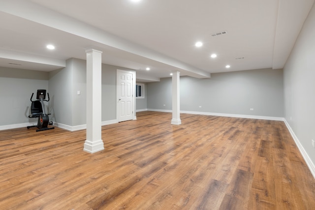 basement with light hardwood / wood-style floors