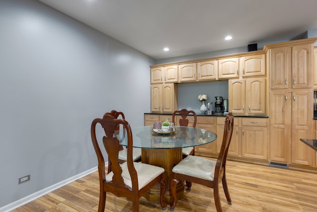 dining area with light wood-type flooring