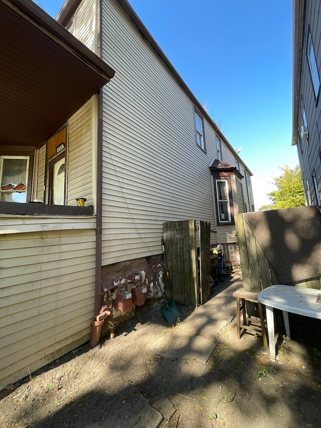 view of side of property with a patio