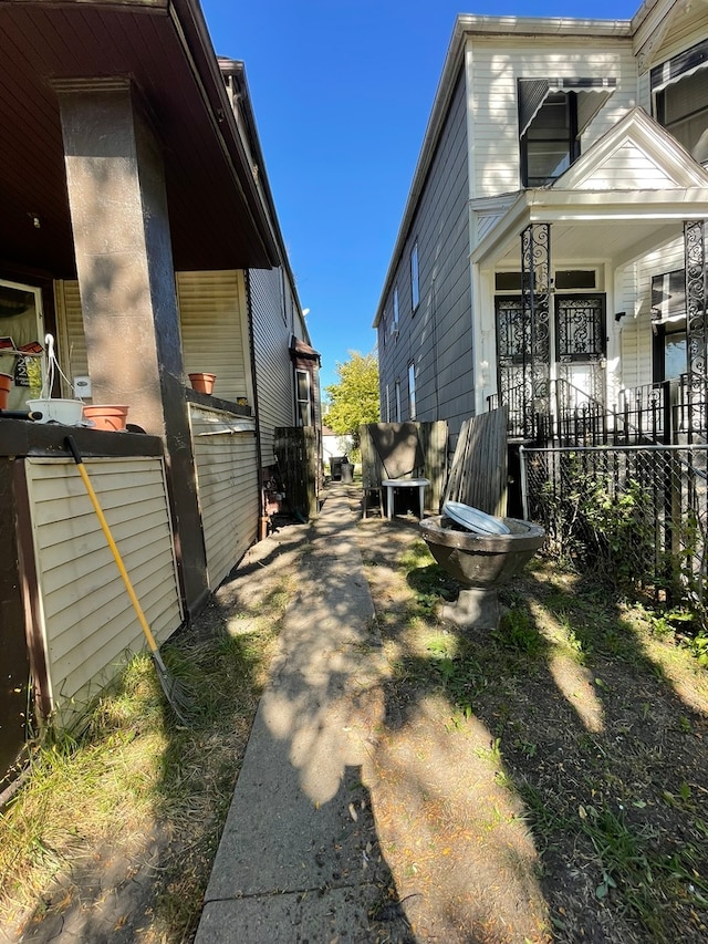 view of property exterior featuring covered porch