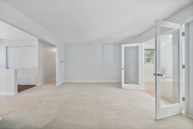 carpeted empty room with french doors