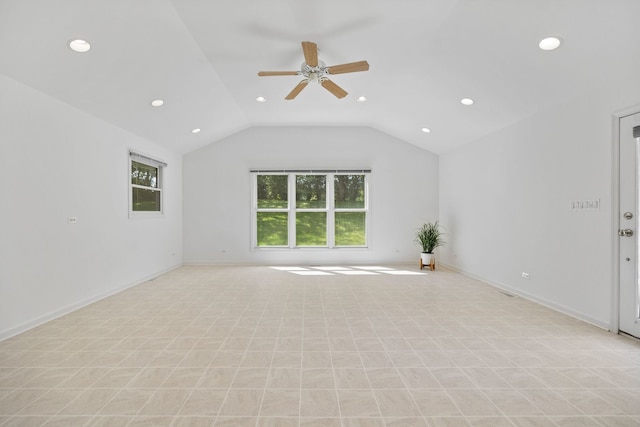 unfurnished living room featuring ceiling fan, lofted ceiling, and plenty of natural light