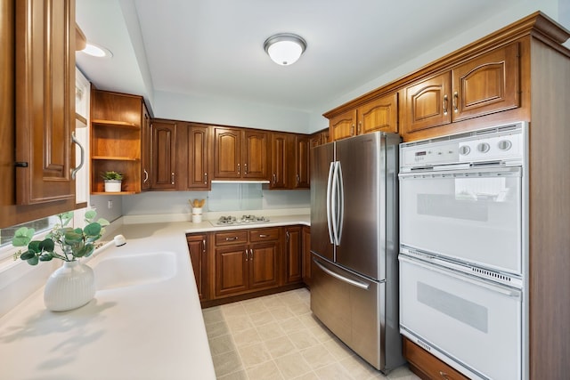 kitchen with white appliances and sink