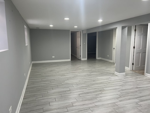 basement featuring light hardwood / wood-style flooring