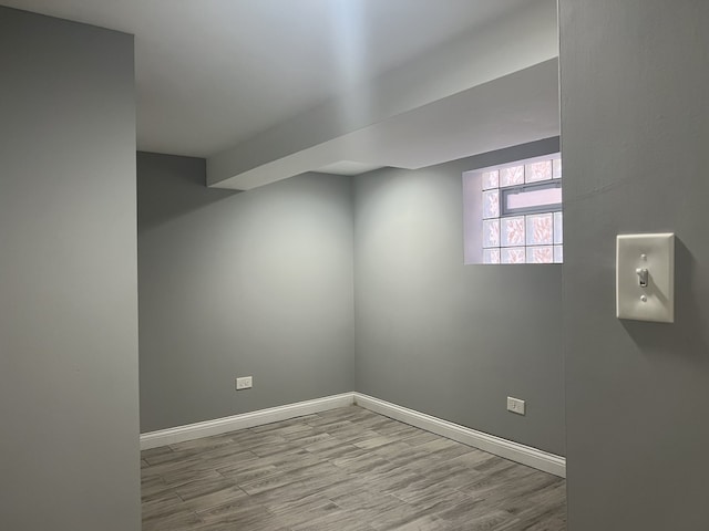 basement featuring light hardwood / wood-style floors