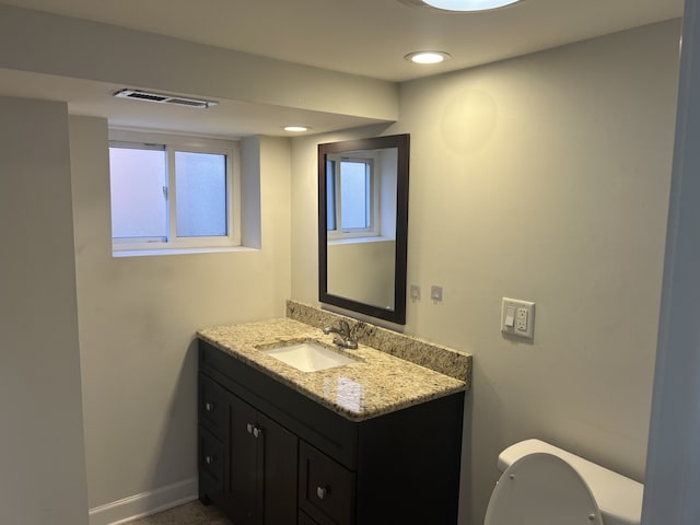 bathroom with vanity and toilet