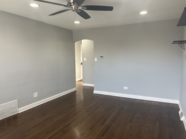 empty room featuring dark hardwood / wood-style floors and ceiling fan