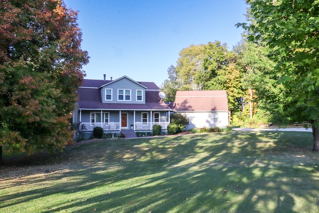 view of front facade featuring a front lawn and a porch