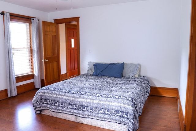 bedroom featuring dark hardwood / wood-style flooring