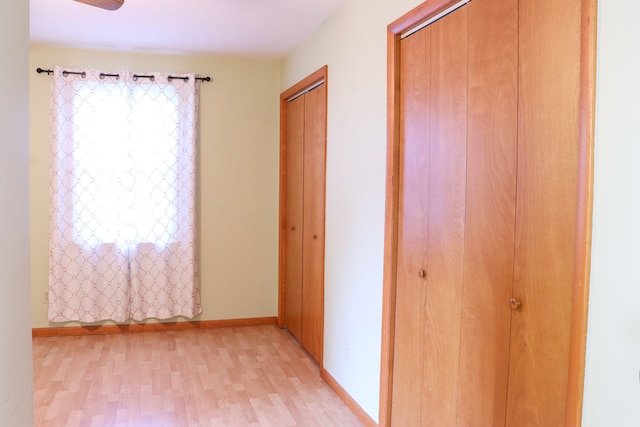 corridor featuring light hardwood / wood-style flooring