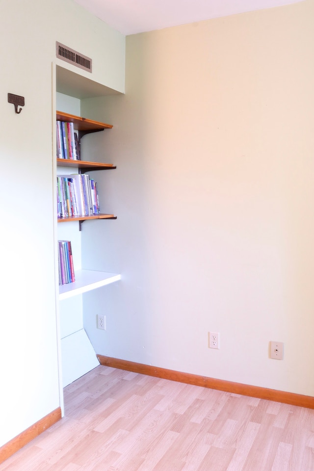 unfurnished room with light hardwood / wood-style flooring